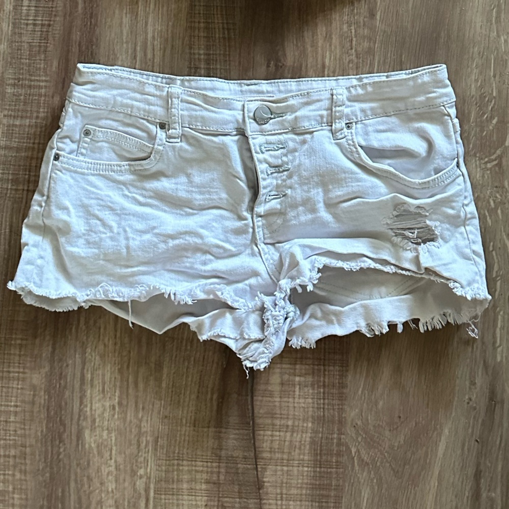Billabong white low rise white Jean distressed button fly shorts